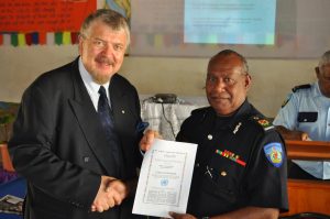 Mr Palu Lui, Commissioner of the Vanuatu Police Force is awarded Ciitizen for Humanity Certificate by Dr Sev Ozdowska, OAM, ACHRE President after participation with other Senior Police Officers in Human Rights training in Port Villa on 18 September 2009.